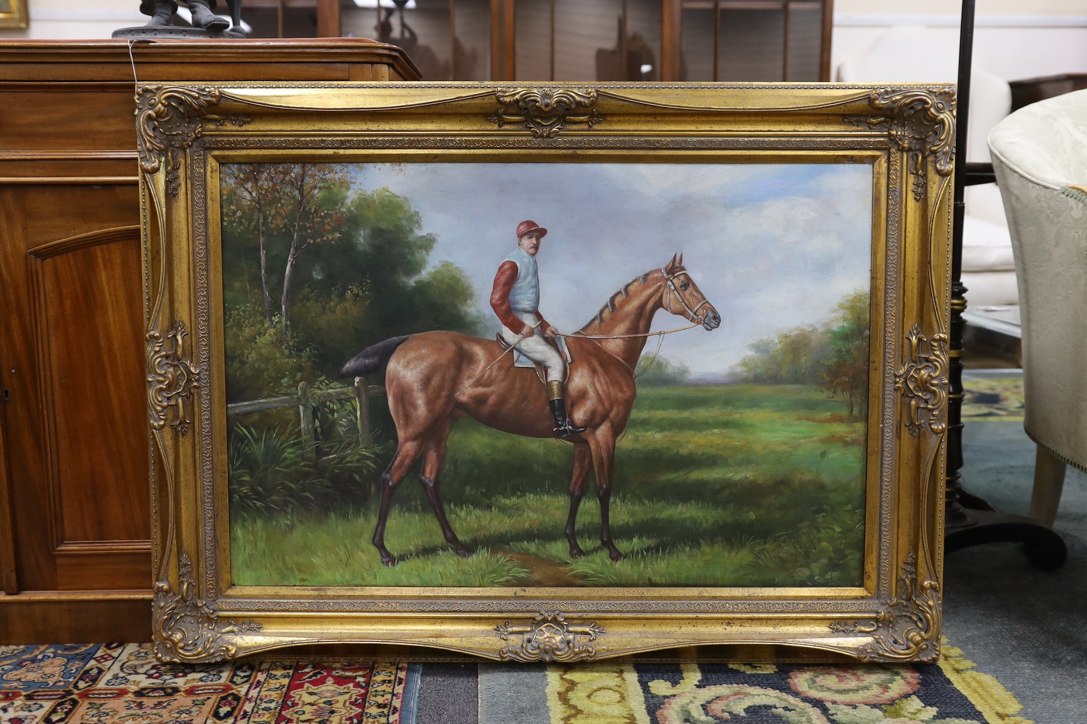 A modern oil on canvas of a racehorse, 60 x 90cm.